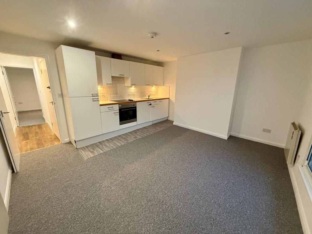 Lot: 123 - TOWN CENTRE FLAT FOR REFURBISHEMNT - Living room with kitchen